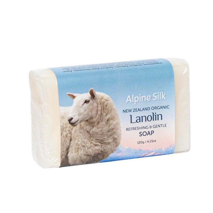 Bar of soap. White with sheep image on packaging.
