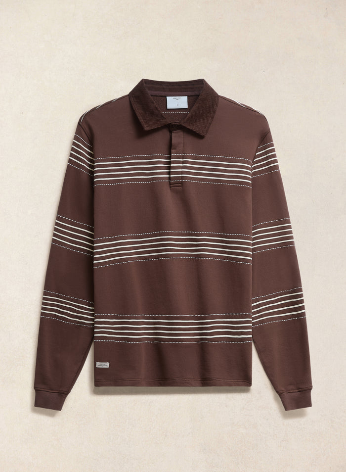 The Percival Editor Striped Rugby Polo in espresso brown cotton with a cord collar and white stripes, shown flat.