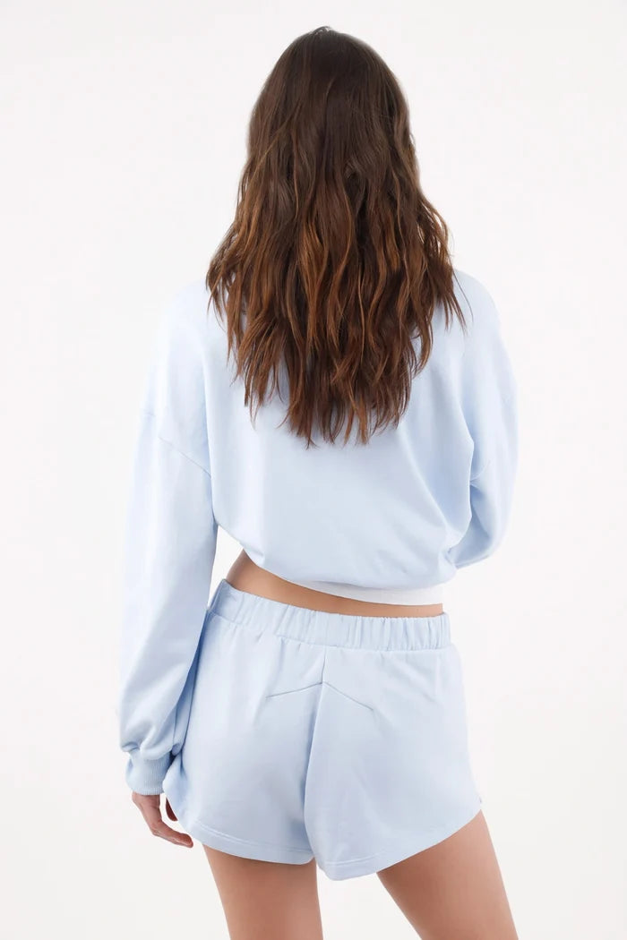 Light blue cotton bermuda shorts for women with a relaxed fit and wide elastic waistband