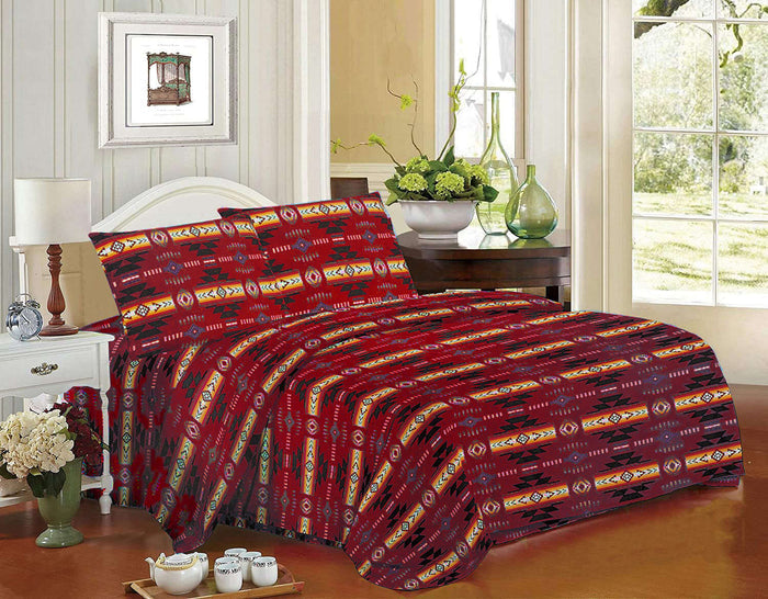 Queen 4pc Sheet Set – Red featuring a classic Navajo print on a bed with pillows and decorative items.