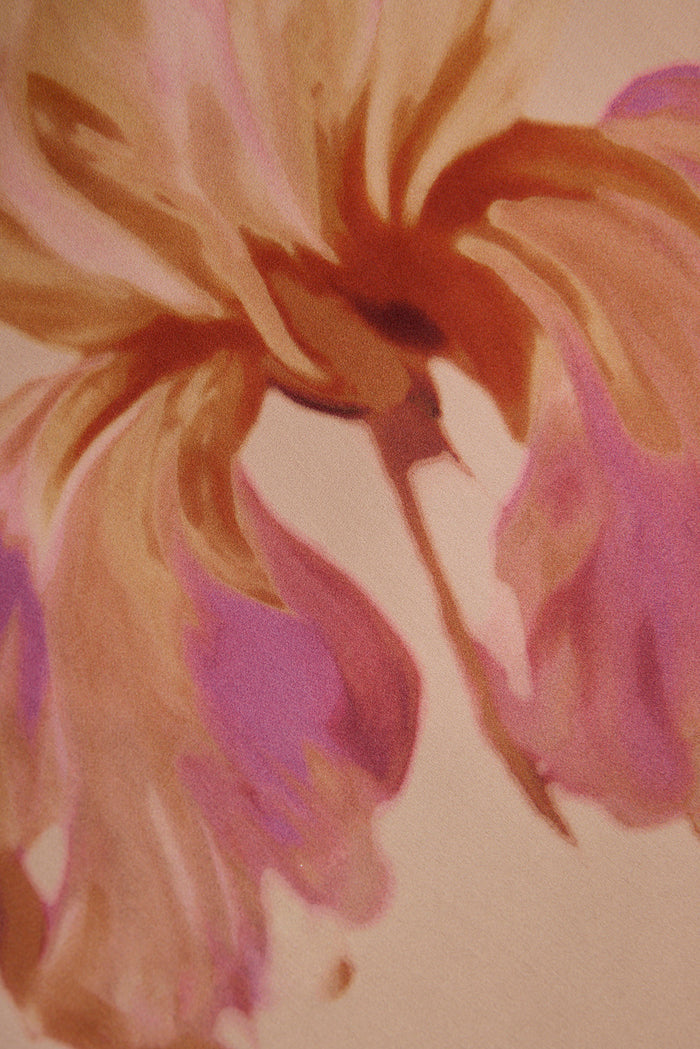 Watercolor pink and rust floral print on the satin fabric of the Valentina maxi dress.