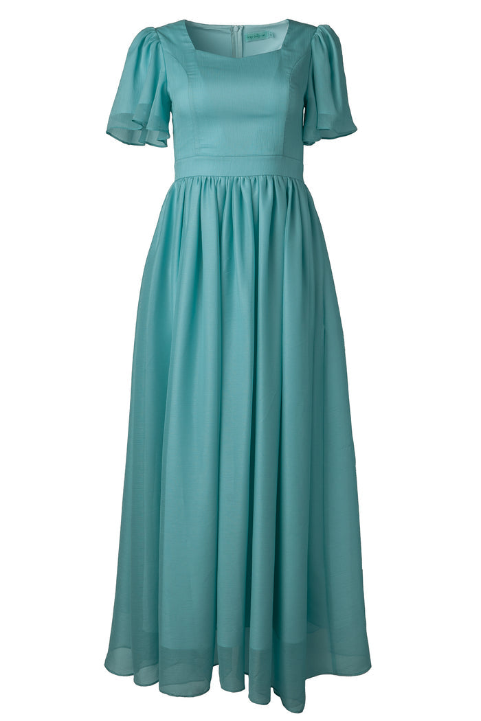 The Abbie Dress in Seaglass Chiffon by Ivy City Co features short puffed sleeves, a fitted bodice, gathered skirt, and square neckline—an airy, light blue choice perfect for fall bridesmaids.