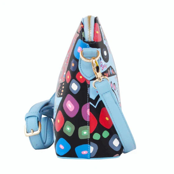 Colorful geometric patterned handbag with blue strap on a white background