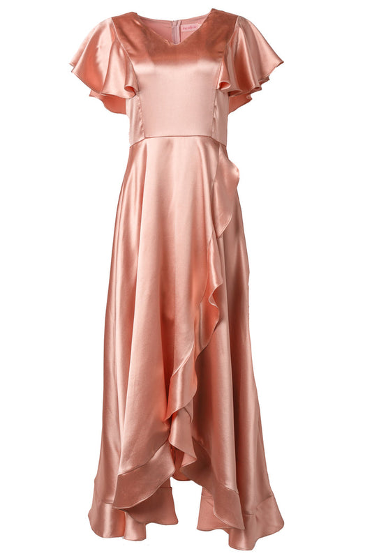 The Callie Dress in Apricot Crush Satin by Ivy City Co features flutter sleeves, a fitted bodice, flared skirt, and ruffled asymmetrical hem—making it a stunning bridesmaid dress with a soft sheen.
