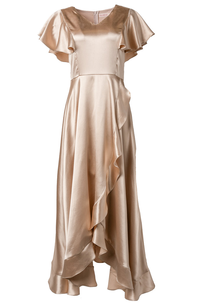 The Callie Dress in Champagne Satin by Ivy City Co features flutter sleeves, a fitted bodice, and an asymmetrical ruffled skirt. With its soft sheen and elegant style, it's ideal for bridesmaids or any formal event.