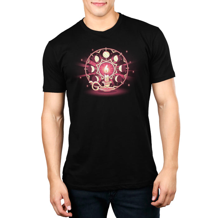 Premium Cotton T-shirt_TeeTurtle Candlelit Orbit black t-shirt featuring a lit candle on a holder in front of a circular arrangement depicting the lunar cycle, with glowing stars in the background.