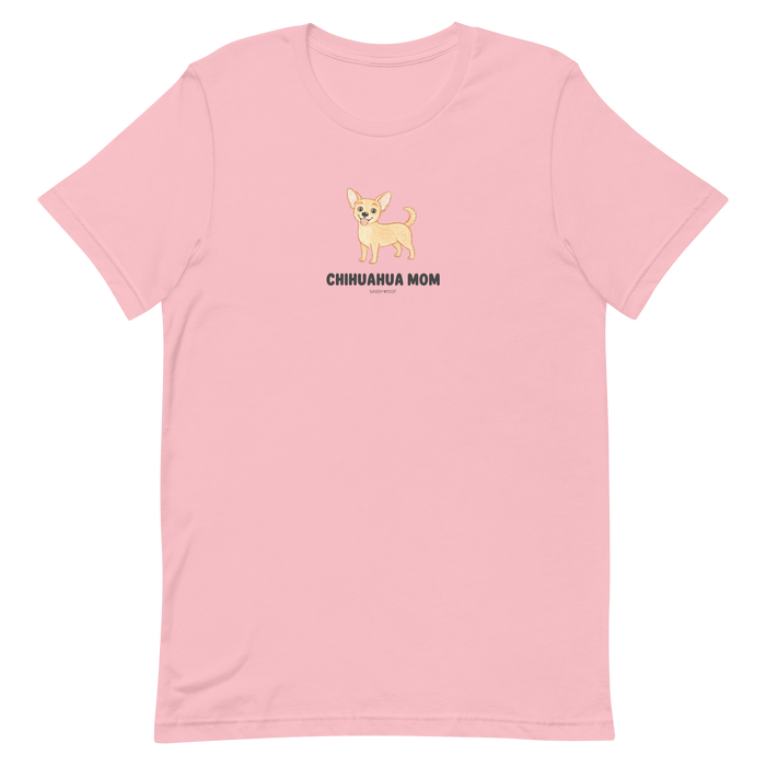 The Sassy Woof Chihuahua Mom Tee is a light pink unisex shirt with a cute cartoon chihuahua and bold "CHIHUAHUA MOM" text on the chest—perfect for proud pet owners.