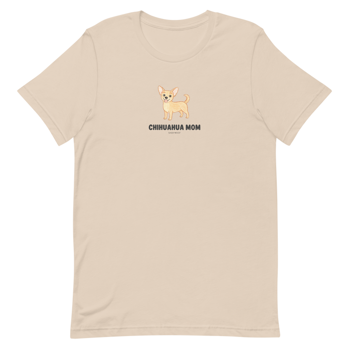The Sassy Woof Chihuahua Mom Tee is a beige unisex shirt with a cute illustrated chihuahua and bold "CHIHUAHUA MOM" text—perfect for chihuahua lovers or breed t-shirt collectors.