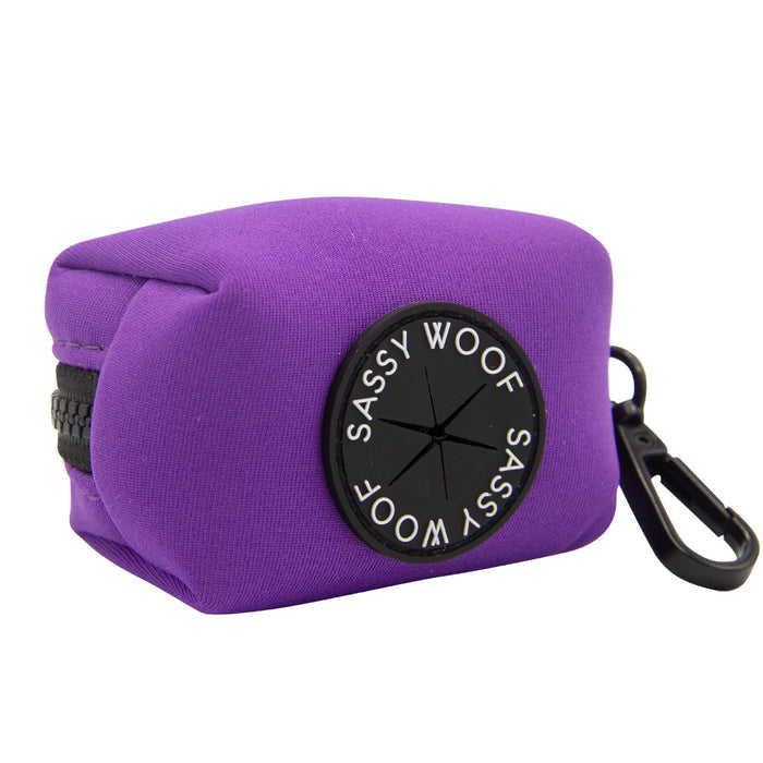 The Sassy Woof Dog Four Piece Bundle - Neon Purple includes a small, purple zipper pouch with a black clip and SASSY WOOF patch—ideal for walks and pairs perfectly with your neon harness or adjustable collar.