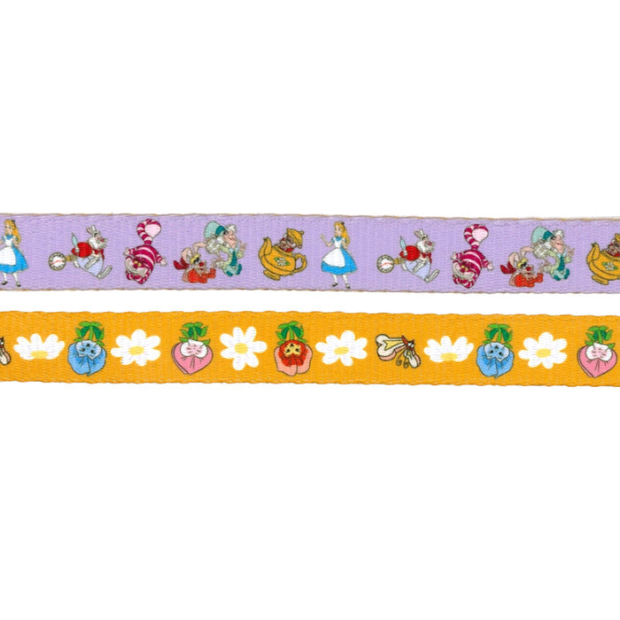 The purple Dog Leash - Alice in Wonderland by Sassy Woof features whimsical characters, while the yellow ribbon showcases white flowers and colorful fruits—a perfect mix for playful pet accessories!.