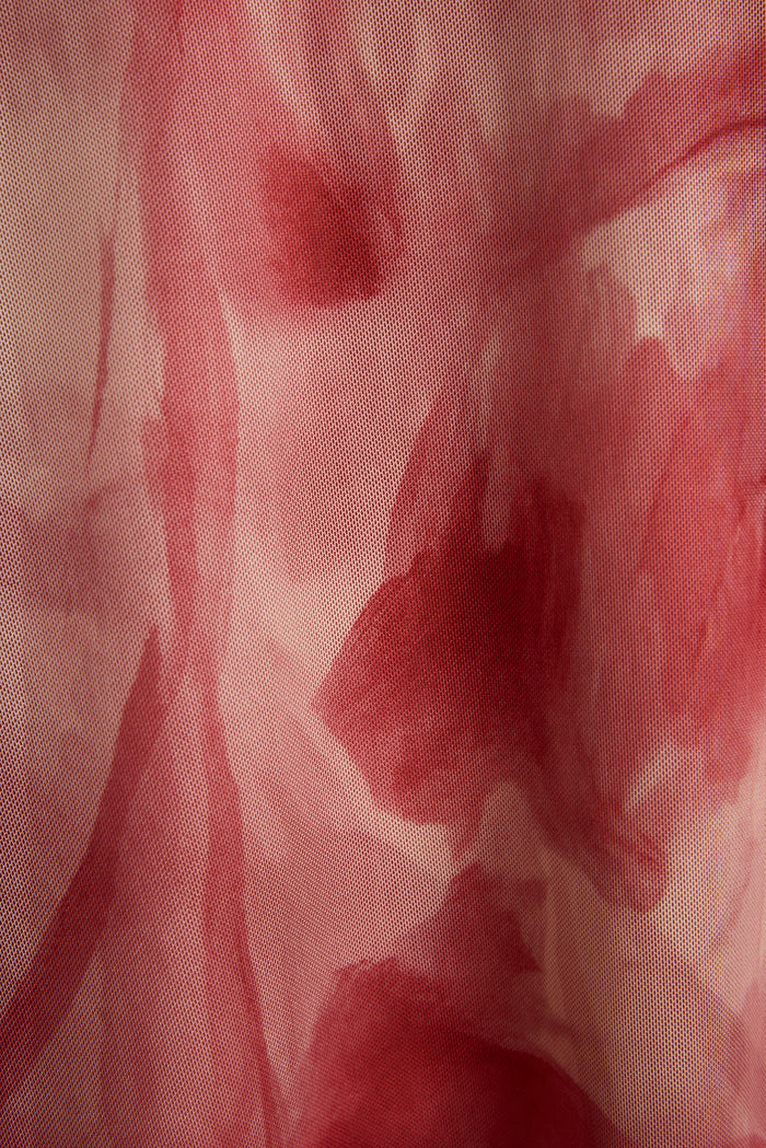 Close-up of pink floral printed mesh fabric on the Everly midi dress.
