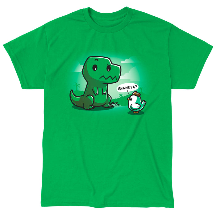 Classic Cotton T-shirt_Teeturtle Family Reunion Irish green t-shirt   featuring a cartoon dinosaur with a puzzled expression sitting in front of a baby chick asking "Grandpa?" on a green background with faint scenery.