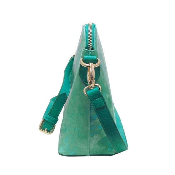 Green handbag with a strap on a white background