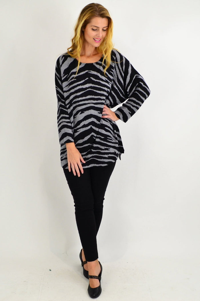 Grey zebra wool blend tunic jumper by Cali&Co, shown on a hanger with a textured fabric and relaxed fit.