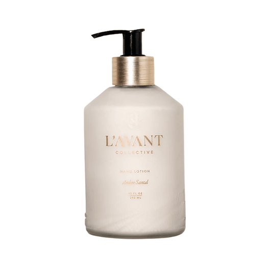 Hand Lotion Ambre Santal | L'AVANT Collective in a matte beige pump bottle with gold and black accents, labeled with elegant gold text for skincare and body care use.