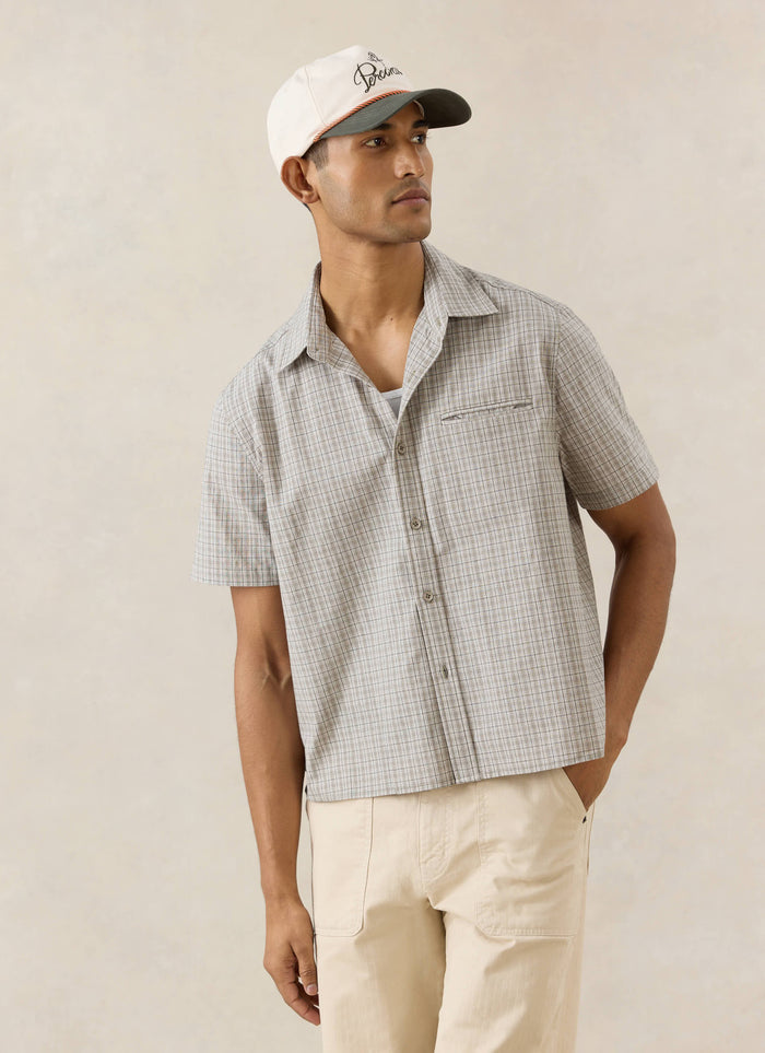 Percival Hinsley Boxy Short Sleeve Shirt in cream check, styled with a rope-detail Spencer cap and Lucas carpenter pants.