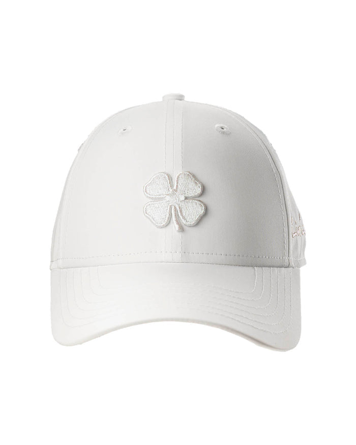 White cap with a shamrock design on a white background