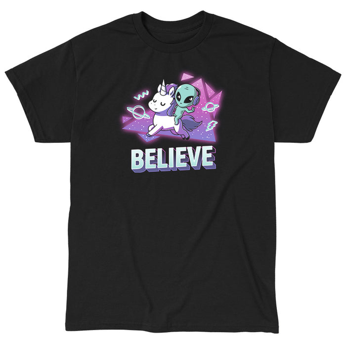 Classic Cotton T-shirt_TeeTurtle black I Believe apparel featuring an alien with headphones on riding a unicorn with a geometric neon 90’s background. Caption says, "BELEIVE".