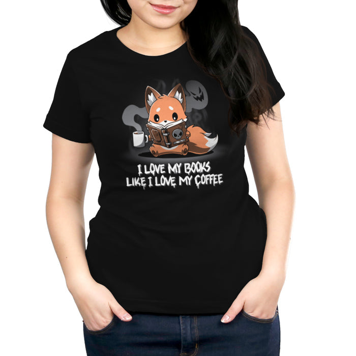 Premium Cotton T-shirt_Teeturtle black I Love My Books Like I Love My Coffee apparel featuring a fox holding a coffee cup with spooky steam and reading a book with a skull on the cover. Text below reads: "I love my books like I love my coffee."