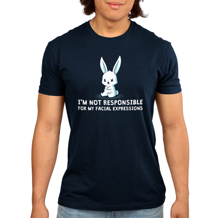 Premium Cotton T-shirt_TeeTurtle navy blue Facial Expressions apparel featuring a cartoon bunny with a grumpy face sits with crossed arms, text below reads "I'M NOT RESPONSIBLE FOR MY FACIAL EXPRESSIONS."