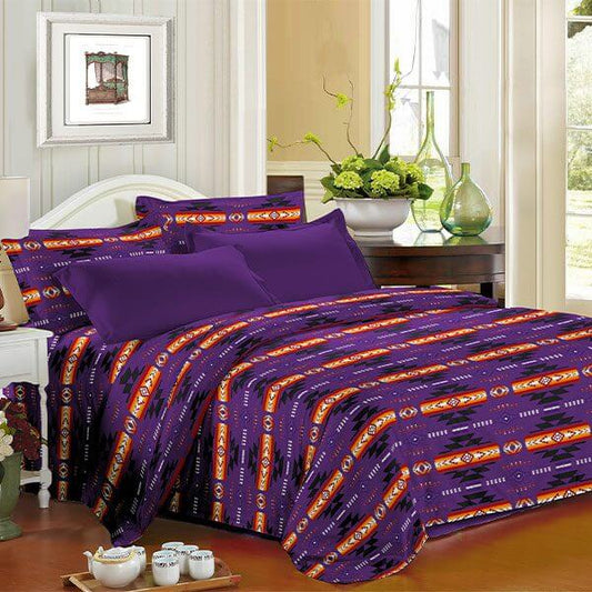 King 4pc Sheet Set – Purple displayed on a bed with a vibrant Navajo print, enhancing bedroom decor and comfort.