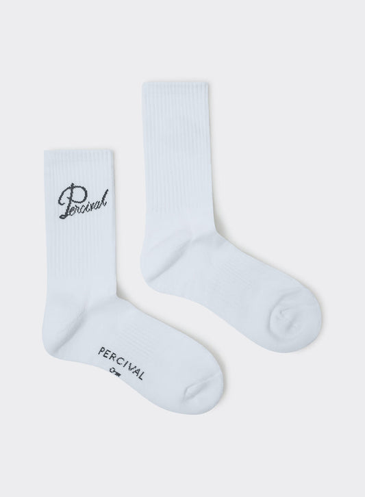 White Percival Kingsley Jacquard Socks in ribbed cotton with script logo embroidery, shown flat against a grey background.