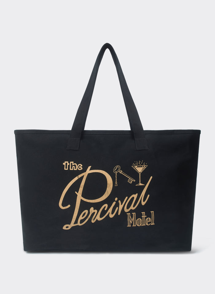The Percival Kingsley Large Tote Bag in black cotton, featuring a gold The Percival Motel graphic and cocktail illustration.