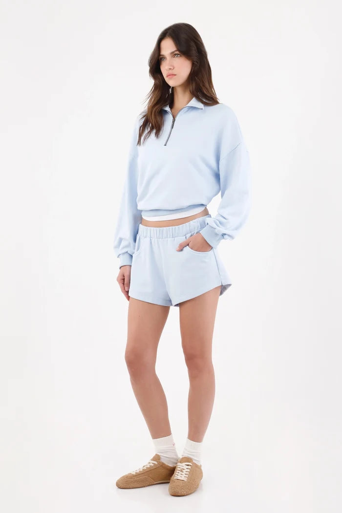Light blue cotton bermuda shorts for women with a relaxed fit and wide elastic waistband