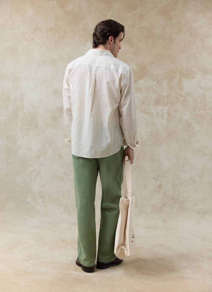 The Percival Lorenzo Pearce Shirt in cream stripe, a breathable lyocell blend long-sleeve shirt shown from the back.