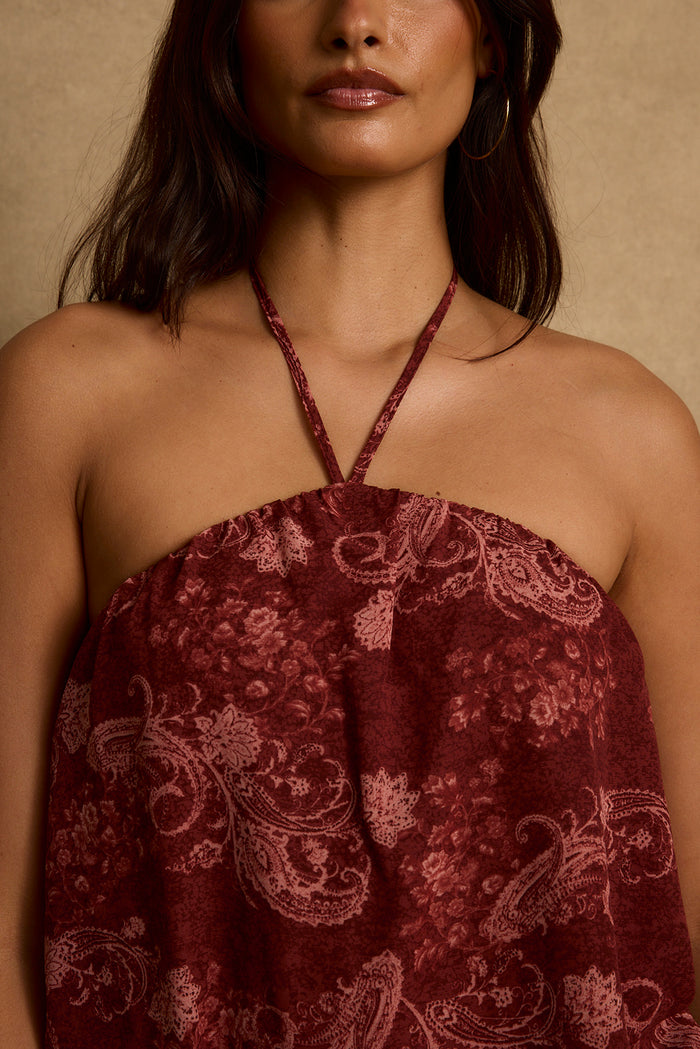 Close-up of halter tie and elastic neckline on mulberry paisley boho mini dress.