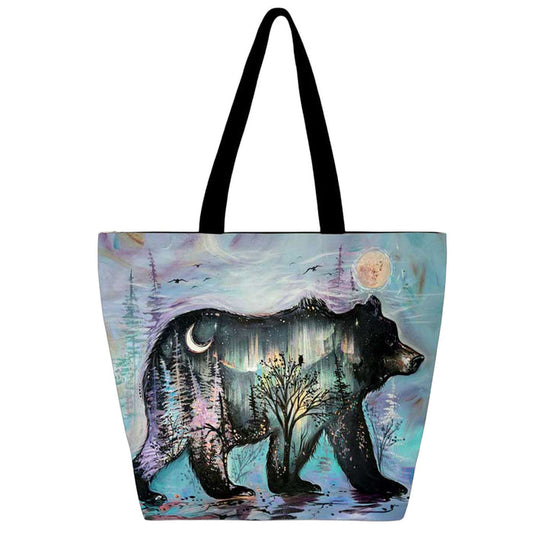 Tote bag with bear design in a forest scene on a white background