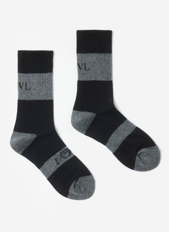 A pair of the Percival PCVL Performance Socks in black and grey, laid flat against a clean white background.