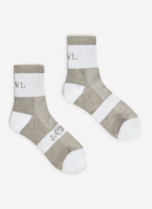A pair of the PCVL Performance Socks in white and grey by Percival, laid out against a plain background.