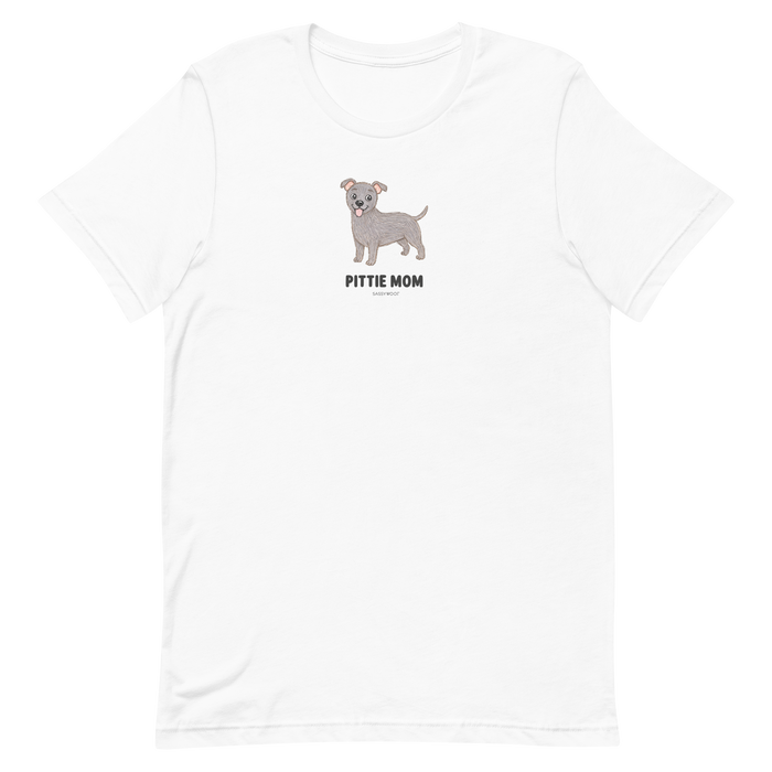 The Pittie Mom Tee by Sassy Woof features a cartoon gray pit bull above bold "PITTIE MOM" text, centered on the chest. This unisex shirt is perfect for proud pitbull moms and dog lovers alike.