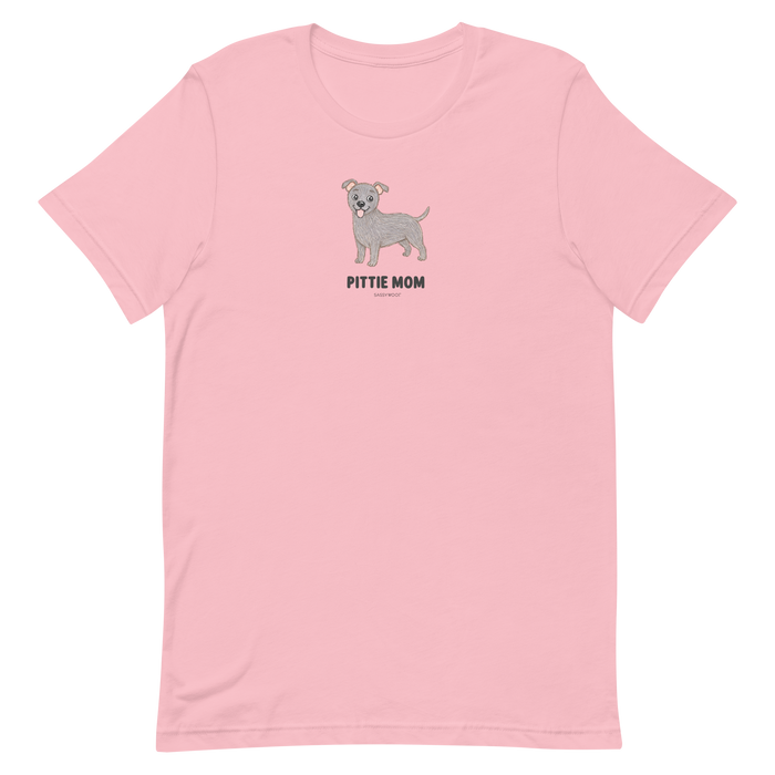 The Pittie Mom Tee by Sassy Woof is a light pink unisex shirt with a cute gray pit bull and bold "Pittie Mom" text centered on the chest—perfect for proud pitbull moms and dog lovers.