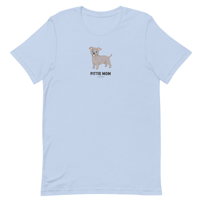 The Sassy Woof Pittie Mom Tee is a light blue unisex shirt featuring a cute cartoon gray pit bull above bold, centered text—ideal for proud pitbull moms and dog lovers.