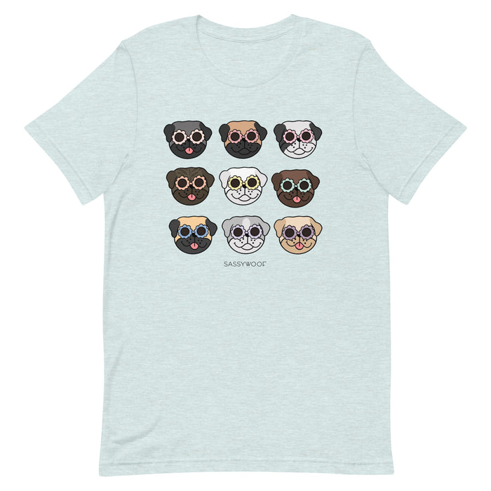 Light gray unisex Pug Tee by Sassy Woof with a grid of nine cartoon pug faces in colorful sunglasses and "SASSY WOOF" below—a fun dog lover’s shirt.
