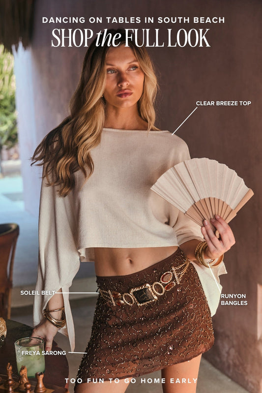 Shop the look: Clear Breeze cream top, beaded Freya sarong skirt, Soleil belt, Runyon bangles.