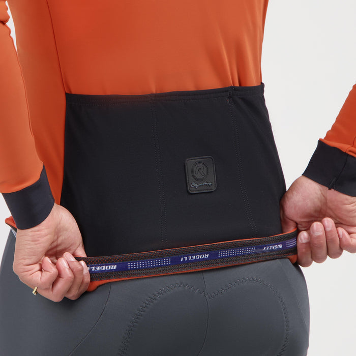 Detail van Rogelli Signature fietsshirt dames oranje lange mouw achterkant.