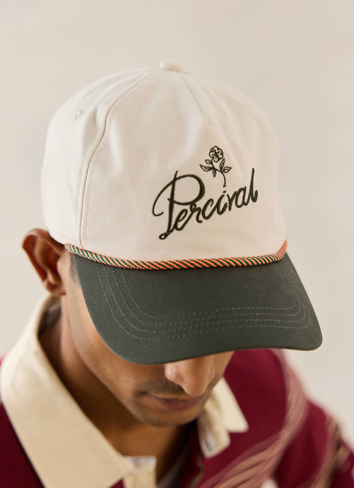 Percival Spencer Soft Trucker Cap in cream brushed cotton with orange rope detailing, styled with the Editor rugby polo.