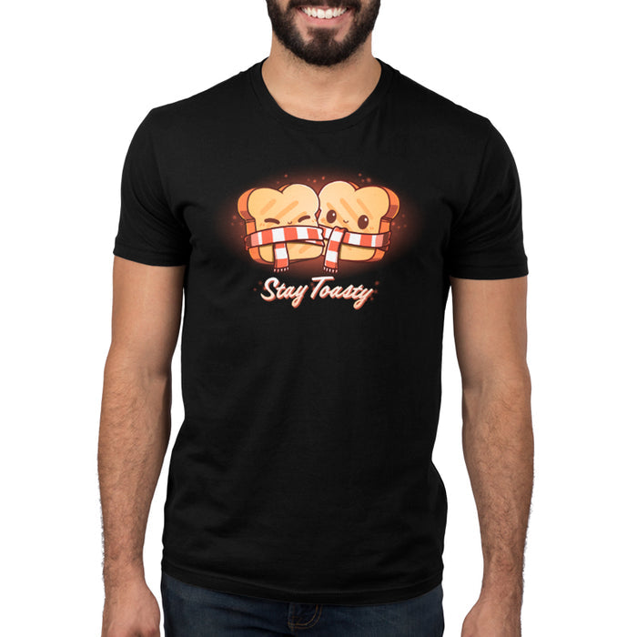 Premium Cotton T-shirt_Teeturtle Stay Toasty black t-shirt featuring two smiling pieces of toast, bundled together with a red and white striped scarf. The text "Stay Toasty" is written below.