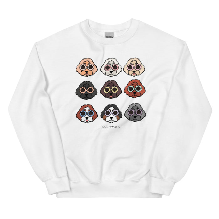 The Sassy Woof Sweatshirt - Doodles is a comfy unisex crewneck featuring a grid of nine colorful illustrated dog faces, with "SASSY WOOF" printed underneath.