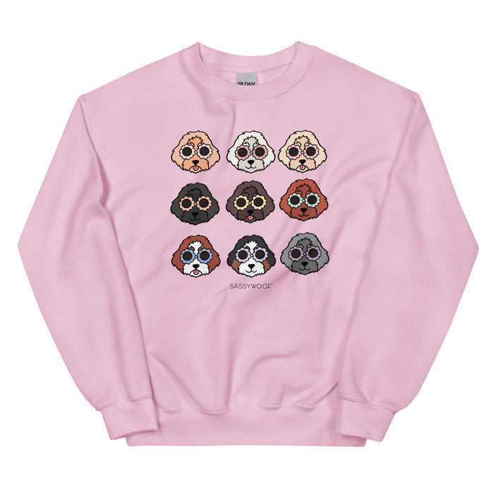 The Sassy Woof Sweatshirt - Doodles features nine cartoon dog faces in three colorful rows with "SASSY WOOF" beneath. This comfy crewneck is perfect for dog lovers.