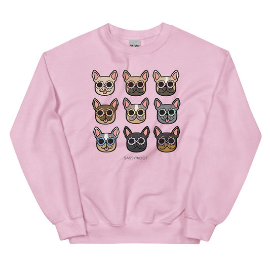 The Sassy Woof Sweatshirt - Frenchies is a pink unisex crewneck with a 3x3 grid of unique Frenchie dog faces in glasses and "SASSY WOOF" below—a fun must-have for any dog lover's apparel collection.