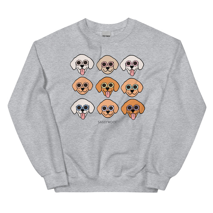 Sassy Woof's "Sweatshirt - Goldens" is a unisex gray crewneck featuring nine cartoon Golden Retriever faces in sunglasses (3x3 grid) and "SASSY WOOF" text, made from a comfy cotton blend.