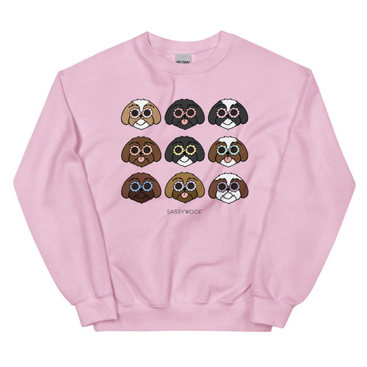 The Sweatshirt - Shih Tzus by Sassy Woof is a pink unisex top featuring cartoon Shih Tzu faces in sunglasses over three rows with “SASSY WOOF” below—an ideal playful gift for any dog lover.