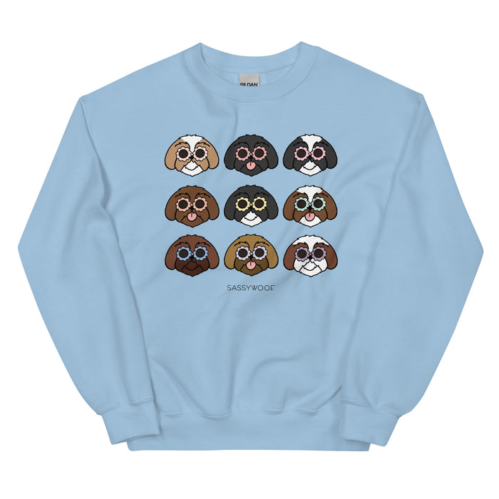 The Sassy Woof Sweatshirt - Shih Tzus is a light blue unisex top with nine cartoon Shih Tzu faces in a grid and “SASSY WOOF” below, making it the perfect gift for dog lovers and a must-have for Shih Tzu fans.