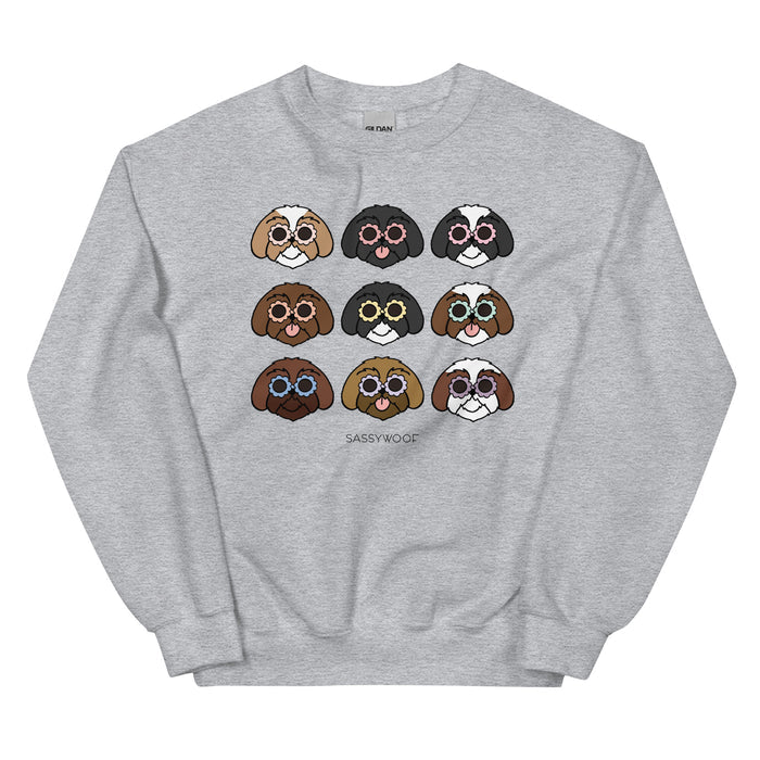 Gray unisex Sassy Woof sweatshirt featuring cartoon Shih Tzus with various fur patterns, all in round glasses. "Sassy Woof" is printed below—an ideal gift for dog lovers.