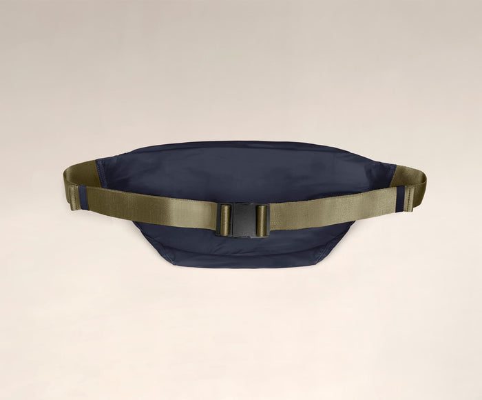 Back view of The Packable Sling Bag's adjustable crossbody strap and buckle closure